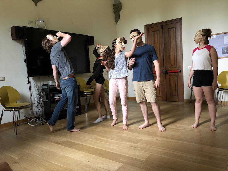 Summer 2018 Commedia dell'Arte students acting out a scene using traditional Commedia masks.